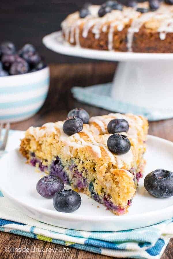 Blueberry Orange Crumble Cake - this soft coffee cake is loaded with fresh blueberries and orange zest. The streusel and glaze give it a sweet topping. Make this easy recipe for breakfast or brunch. #coffeecake #blueberry #orange #breakfast #brunch #mothersday #homemade #recipe #easy