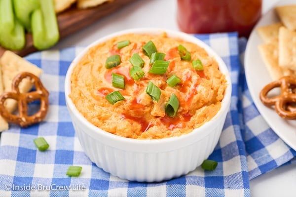 A white bowl filled with a buffalo chicken dip.