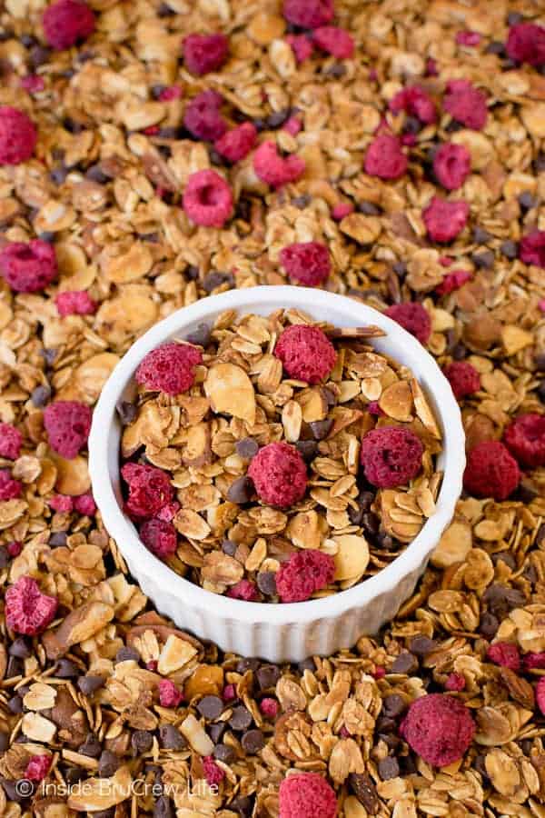 Raspberry Chocolate Chip Granola - this easy homemade granola is loaded with almonds, chocolate, and raspberries. Make this easy granola for cereal or parfaits. #breakfast #granola #homemade #raspberry #chocolate #cereal #parfaits #yogurt