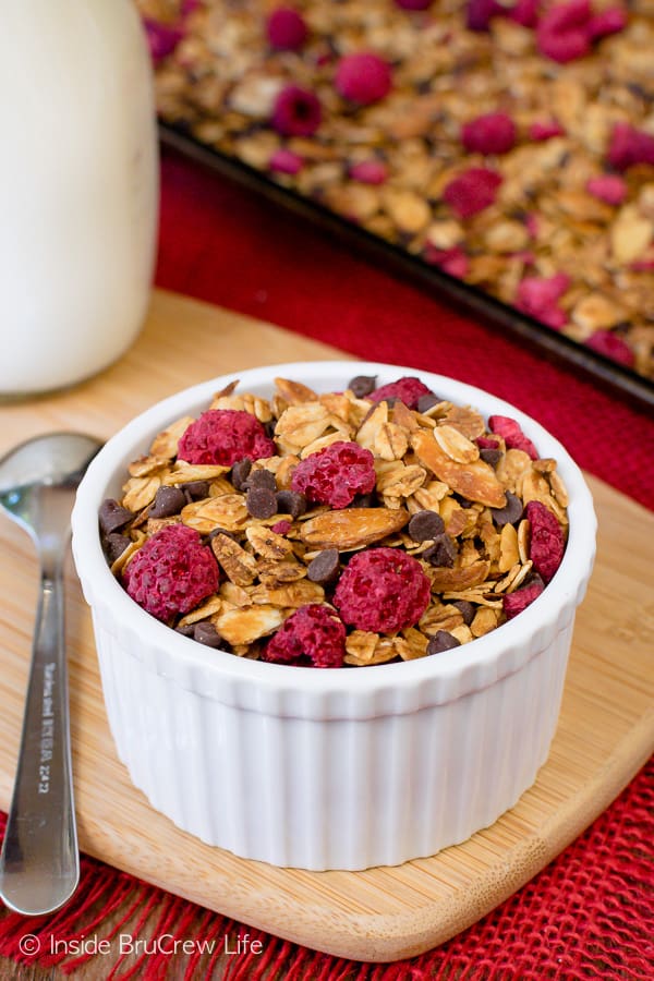 Raspberry Chocolate Chip Granola - homemade granola loaded with chocolate and raspberries makes a delicious cereal or yogurt parfait. Make this easy recipe to have on hand for munching. #breakfast #granola #homemade #raspberry #chocolate #cereal #parfaits #yogurt