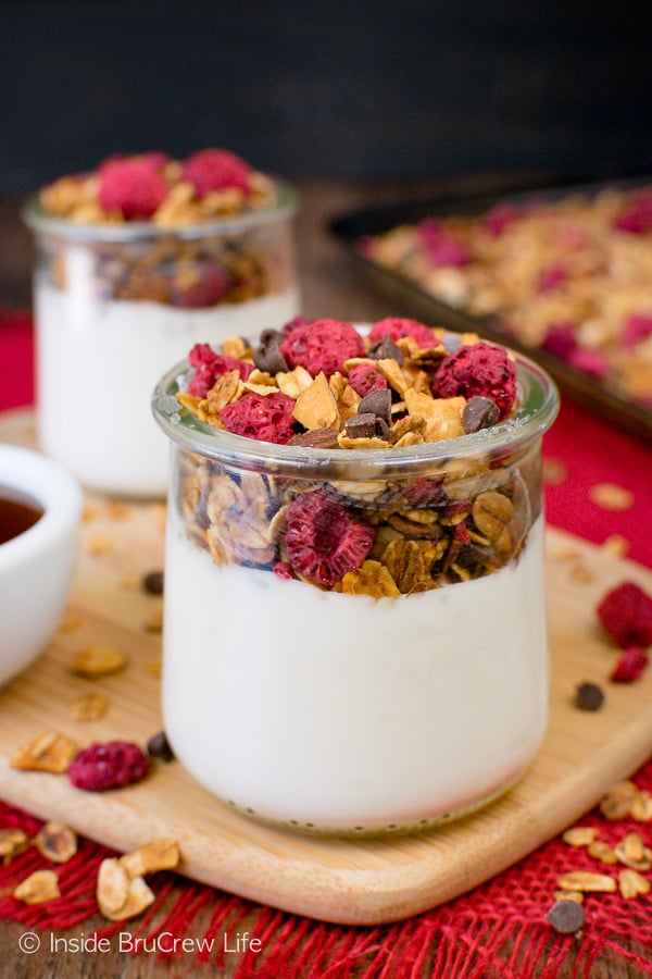 Raspberry Chocolate Chip Granola - this homemade granola is loaded with chocolate, almond, and raspberry crunch. Make this easy granola for cereal or yogurt parfaits. #breakfast #granola #homemade #raspberry #chocolate #cereal #parfaits #yogurt