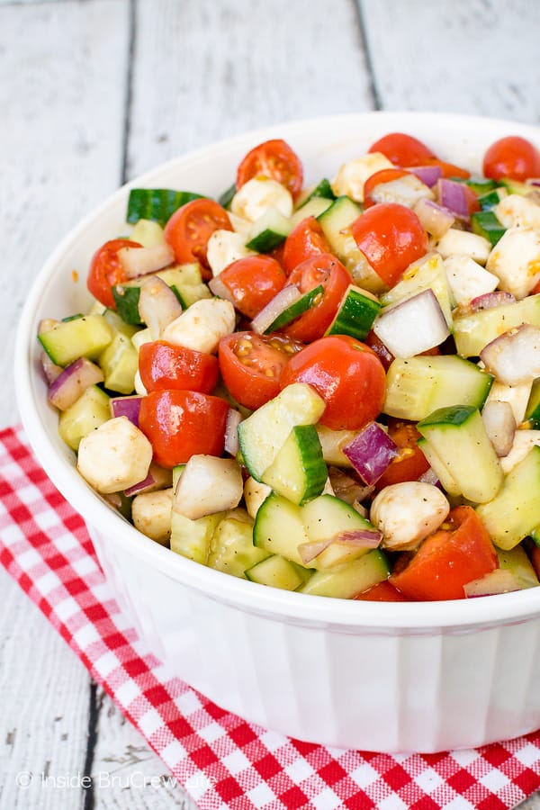 Balsamic Caprese Veggie Salad - this easy four ingredient veggie salad is the perfect side dish for any meal. Make this healthy recipe for summer parties and picnics. #salad #healthy #tomatoes #cucumber #picnic #sidedish #veggies #leanandgreen