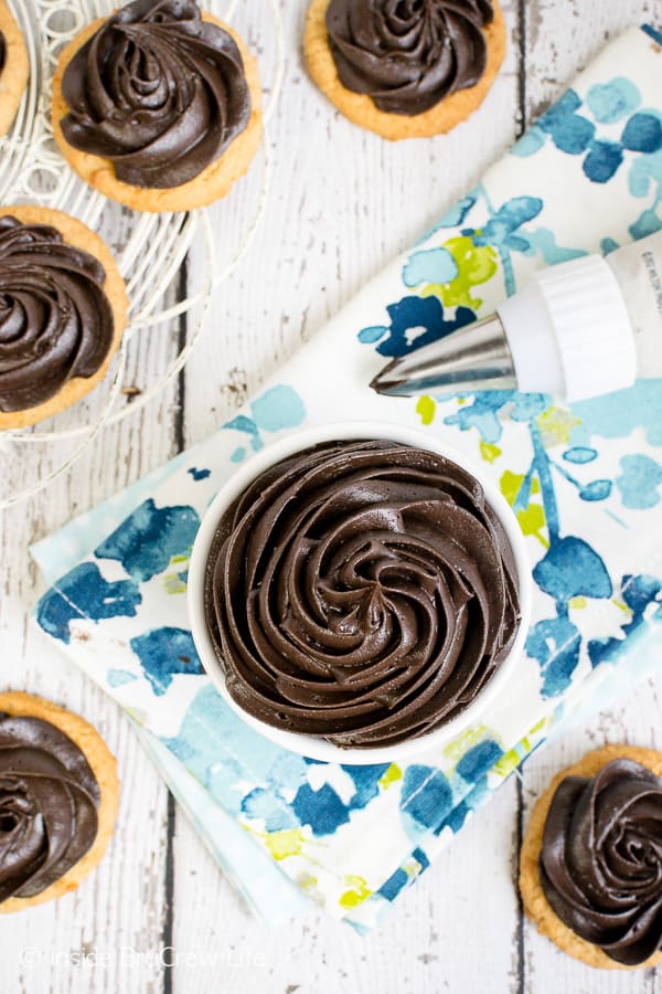 Dark Chocolate Buttercream Frosting - this homemade chocolate frosting made with dark cocoa powder is perfect on cakes, cookies, or cupcakes. Try this easy recipe on your next baking day! #chocolate #darkchocolate #frosting #buttercream #homemade