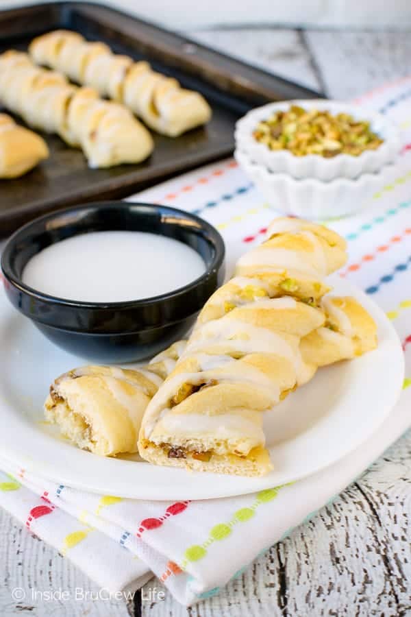 Lemon Pistachio Crescent Twists - an easy breakfast twist filled with lemon curd and pistachios. Make this easy recipe for after school snacks or breakfast treats. #pastry #lemon #pistachios #breakfast #afterschoolsnacks #recipe