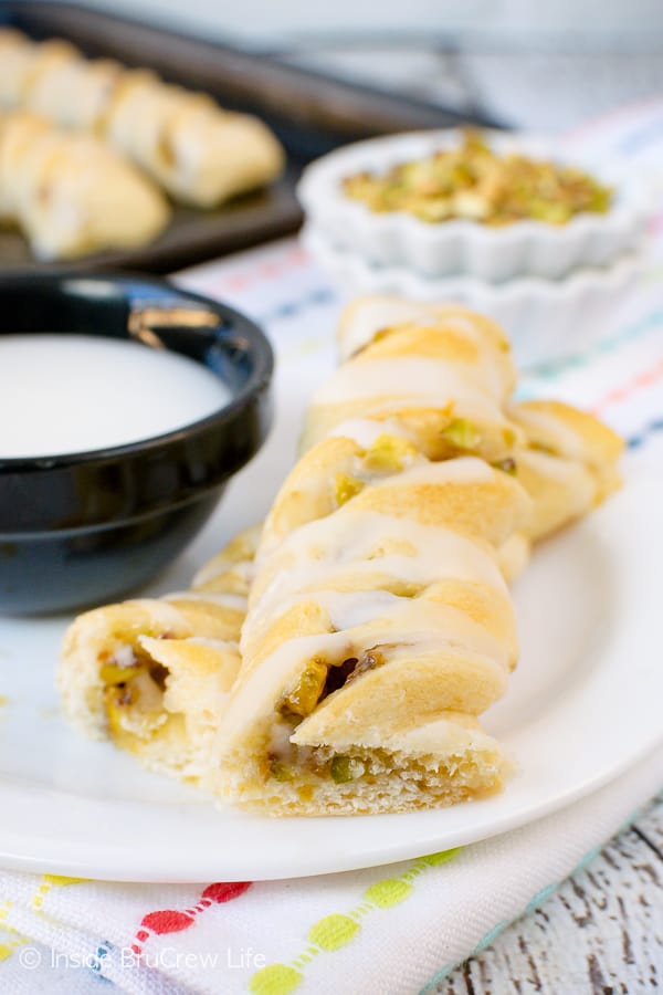 Lemon Pistachio Crescent Twists - this easy three ingredient pastry is the perfect breakfast or after school snack. Make this easy recipe ahead of time for easy snacks. #pastry #lemon #pistachios #breakfast #afterschoolsnacks #recipe