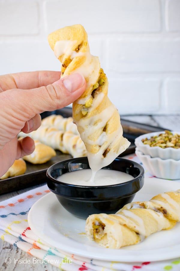 Lemon Pistachio Crescent Twists - an easy breakfast pastry filled with lemon and nuts and drizzled with glaze is a great idea. Make this easy recipe for breakfast or after school snacks. #pastry #lemon #pistachios #breakfast #afterschoolsnacks #recipe