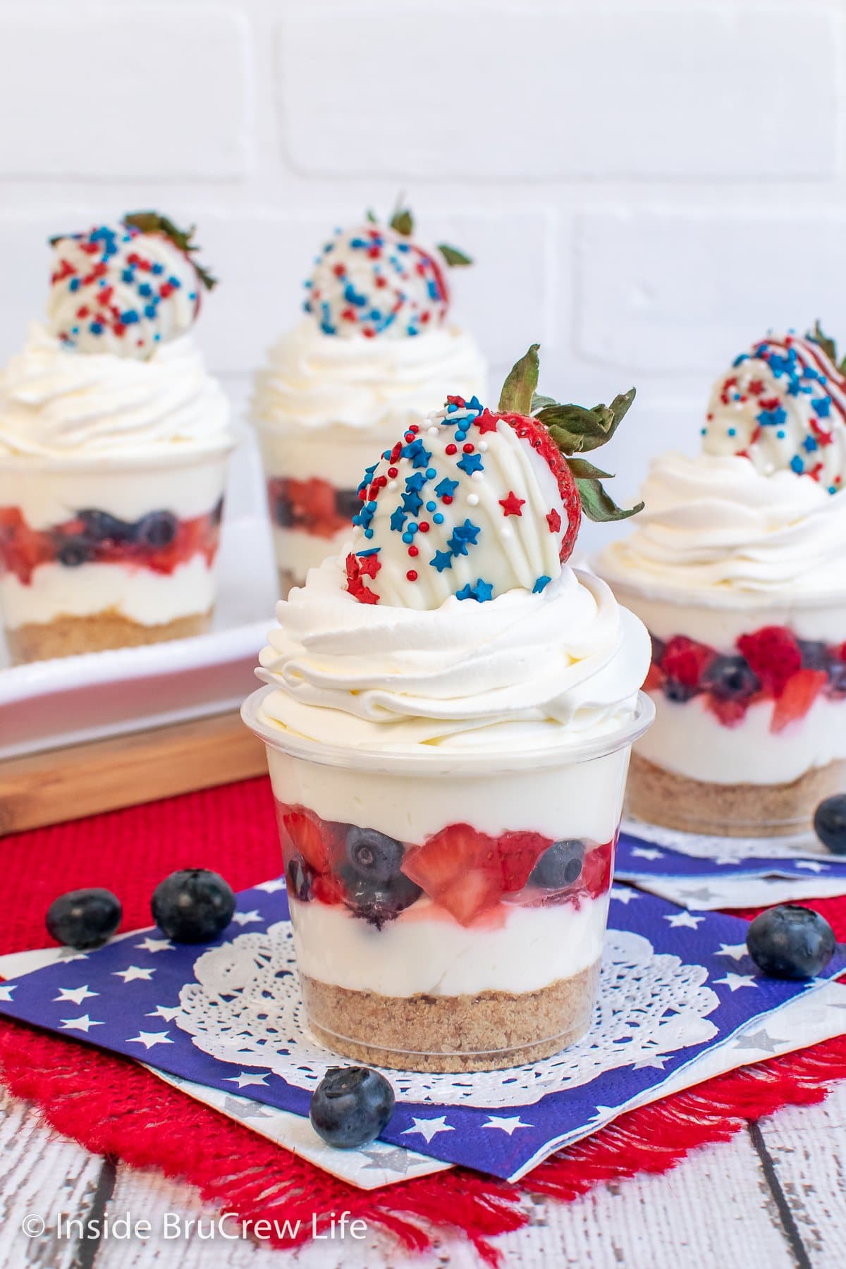 Cheesecake parfaits made with a layer of fresh fruit.