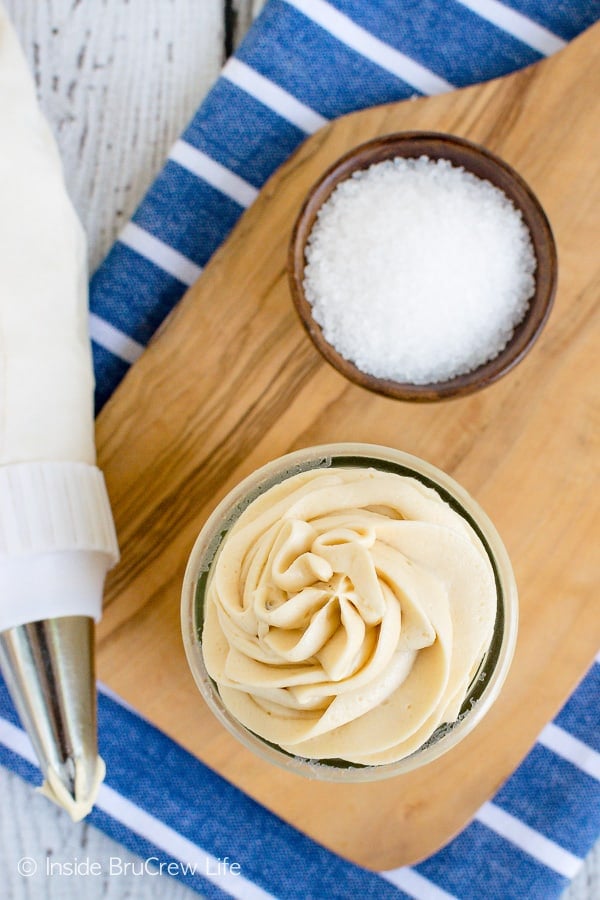 Overhead picture of a bowl with a swirl of caramel frosting in it.