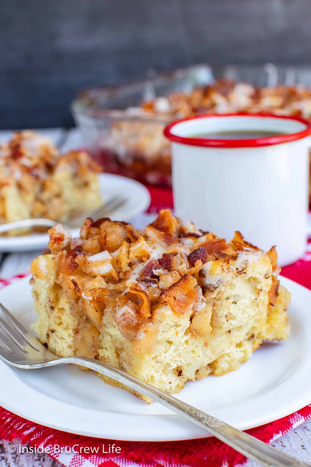 A square of french toast casserole on a white plate.