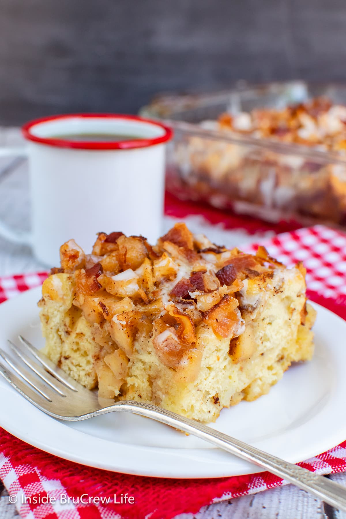 A slice of breakfast casserole on a white plate.