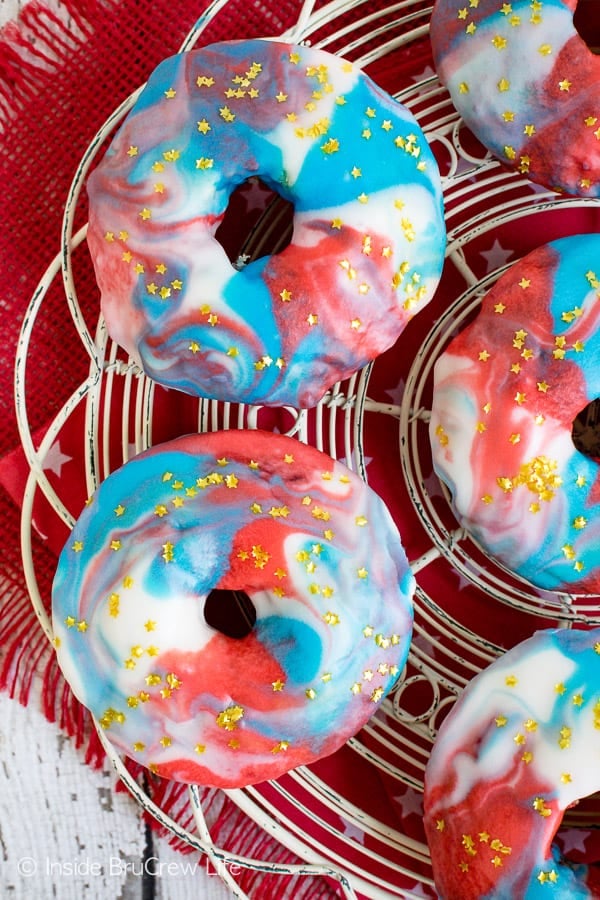 Patriotic Glazed Funfetti Donuts - sprinkles and a swirled glaze make these easy baked donuts a fun summer breakfast. Make this recipe for the 4th of July. #donuts #homemade #funfetti #redwhiteandblue #galaxydonuts #patriotic #4thofJuly #summer