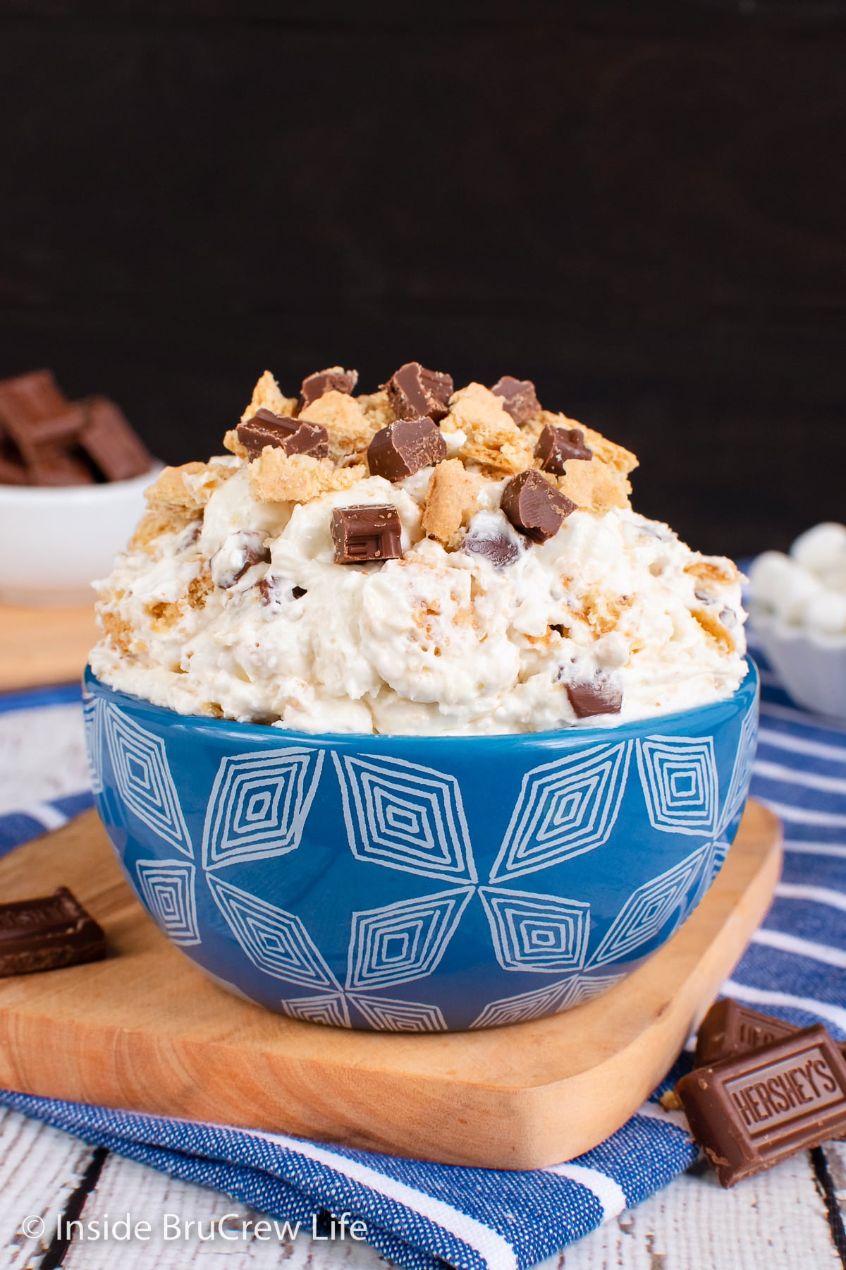 A blue bowl filled with a marshmallow fluff dessert.
