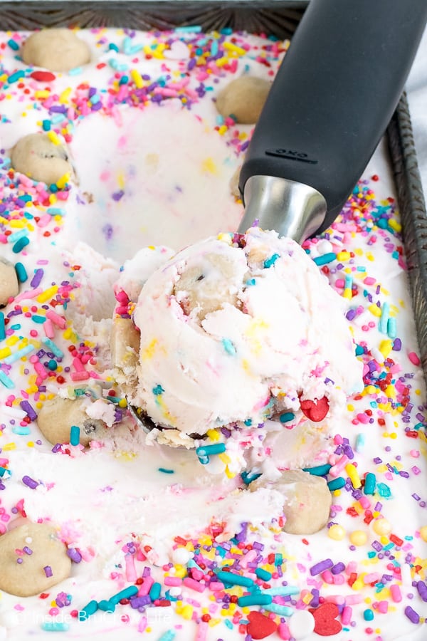 Funfetti Cookie Dough Ice Cream - adding lots of sprinkles and cookie dough bites makes this easy no churn ice cream a fun treat. Make this recipe for those hot summer days! #icecream #nochurn #funfetti #cookiedough #easy #frozendessert #summer #recipe