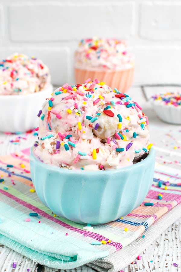 Bowls of ice cream topped with lots of colorful sprinkles.