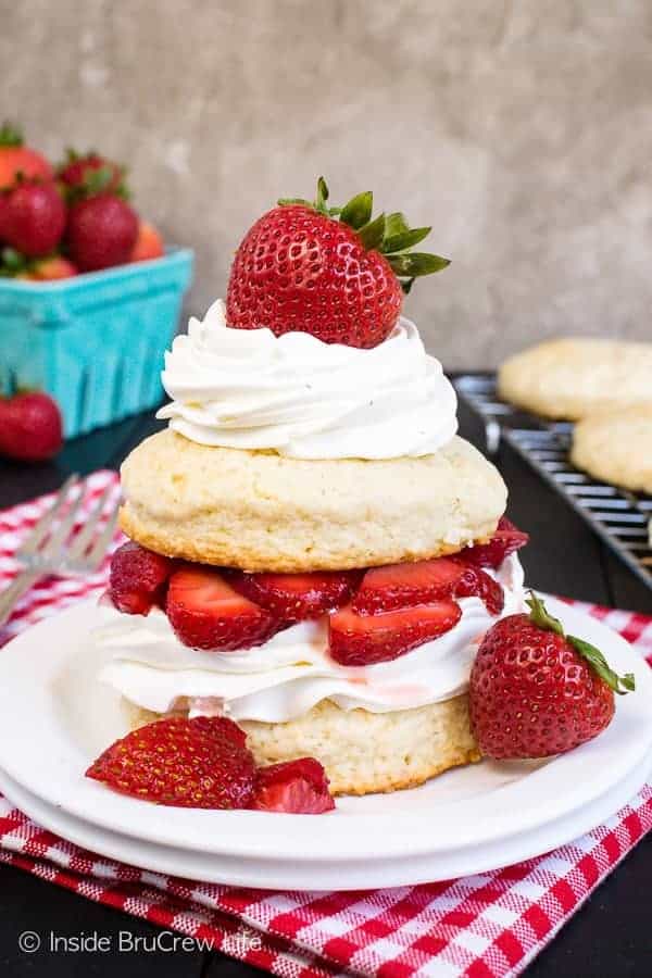 Homemade Strawberry Shortcake - sweet cookie like biscuits topped with sliced strawberries and cream. Make this classic dessert any time of year! #strawberry #shortcake #homemade #biscuits #summerdessert #recipe 