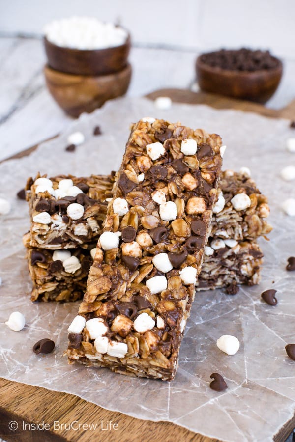 Two nutella s'mores granola bars on a piece of wax paper with another bar leaning up against it the other way