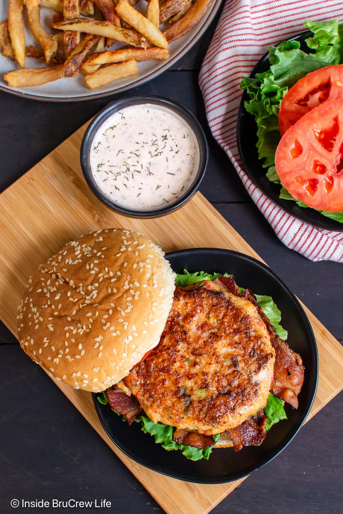 A pan fried shrimp patty on a bun.