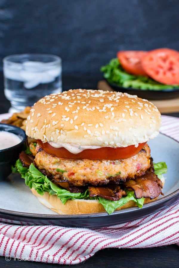 Homemade Cajun Shrimp Burgers - enjoy these easy shrimp burgers with lettuce, tomatoes, bacon, and a homemade cajun dill sauce. Great recipe to try if you are eating healthy! #shrimp #burger #healthy #dinner #recipe #cajun #homemade 