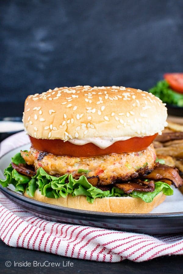 Homemade Cajun Shrimp Burgers - these easy shrimp burgers are loaded with flavor. Eat them on a bun or on lettuce with tomato, bacon, and a homemade cajun dill sauce. Great recipe to try if you are eating healthy. #shrimp #burger #healthy #dinner #recipe #cajun #homemade 