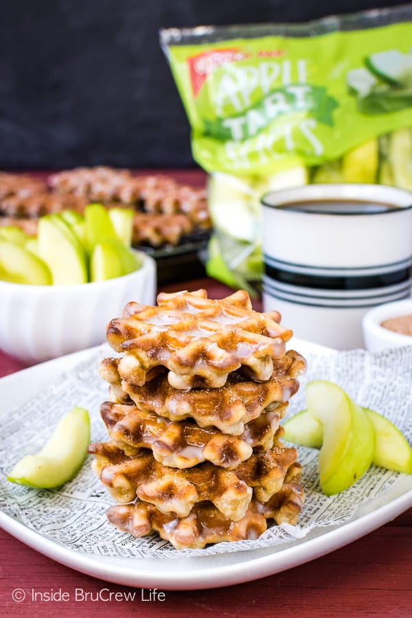 Mini Apple Fritter Waffle Donuts - a sweet glaze and lots of apples make these little waffle donuts a fun fall treat. Try this easy recipe for breakfast or an after school snack! #apple #waffles #donuts #applefritters #fallsnacks #breakfast #afterschoolsnack #waffledonuts #crunchpak