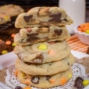 A stack of peanut butter cookies filled with Reese's candies.