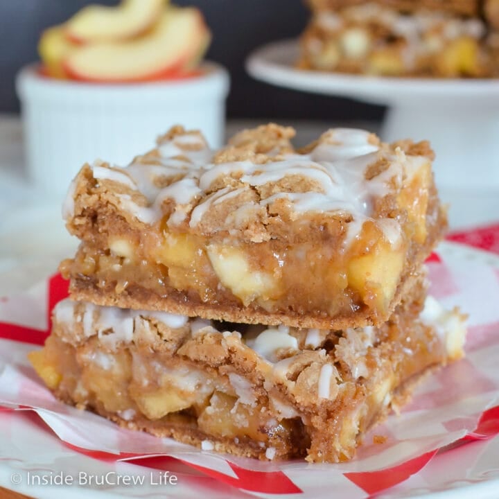 Two apple squares stacked on a white plate.