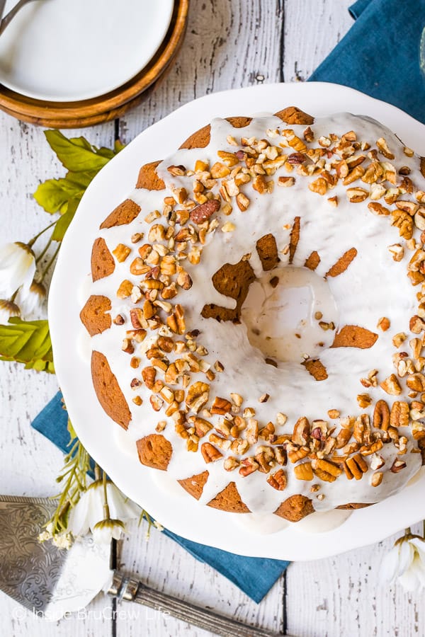 Chai Spiced Apple Bundt Cake - adding chai spices to this easy homemade apple cake was a delicious choice! And a sweet glaze and pecans make it look so pretty. Try this recipe for your fall parties! #cake #apple #chai #bundtcake #homemade #crunchpak #fall #recipe