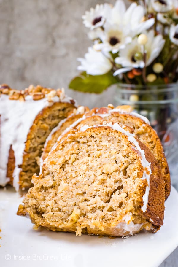Chai Spiced Apple Bundt Cake - this homemade apple cake is loaded with chai spices and topped with a sweet glaze and pecans. It's the perfect fall cake for every party! #cake #apple #chai #bundtcake #homemade #crunchpak #fall #recipe