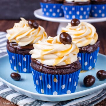 Salted caramel chocolate cupcakes in blue wrappers.