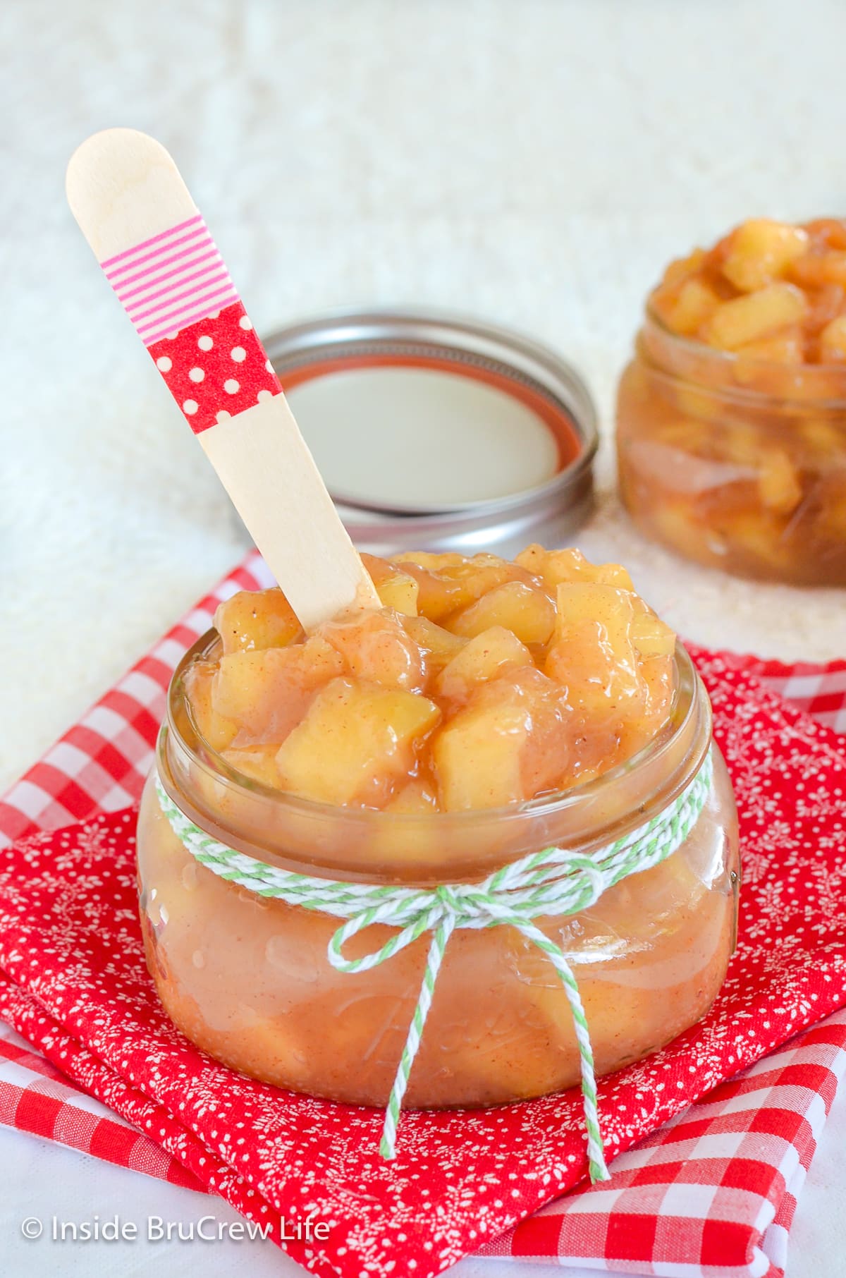 A mason jar filled with apple pie filling.