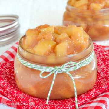 Two clear jars filled with apple filling.