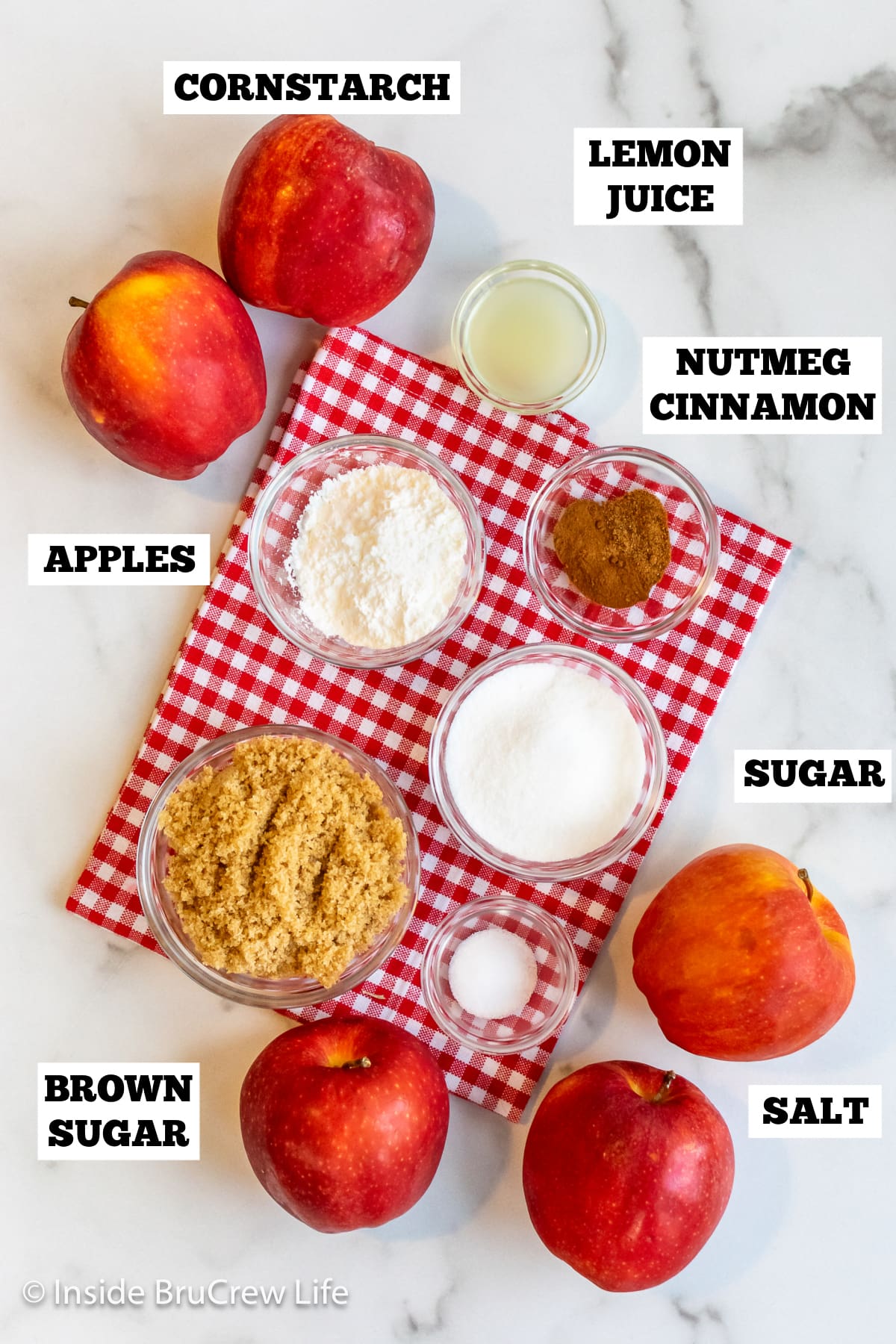 Bowls of ingredients needed to make homemade apple pie filling.