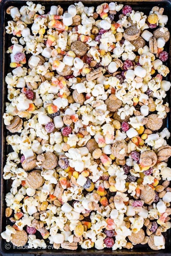 Overhead picture of a sheet pan filled with candy corn popcorn.