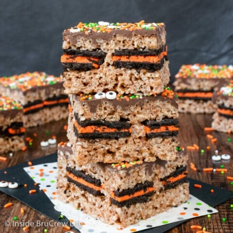 Three Oreo stuffed rice krispie treats stacked on top of each other.