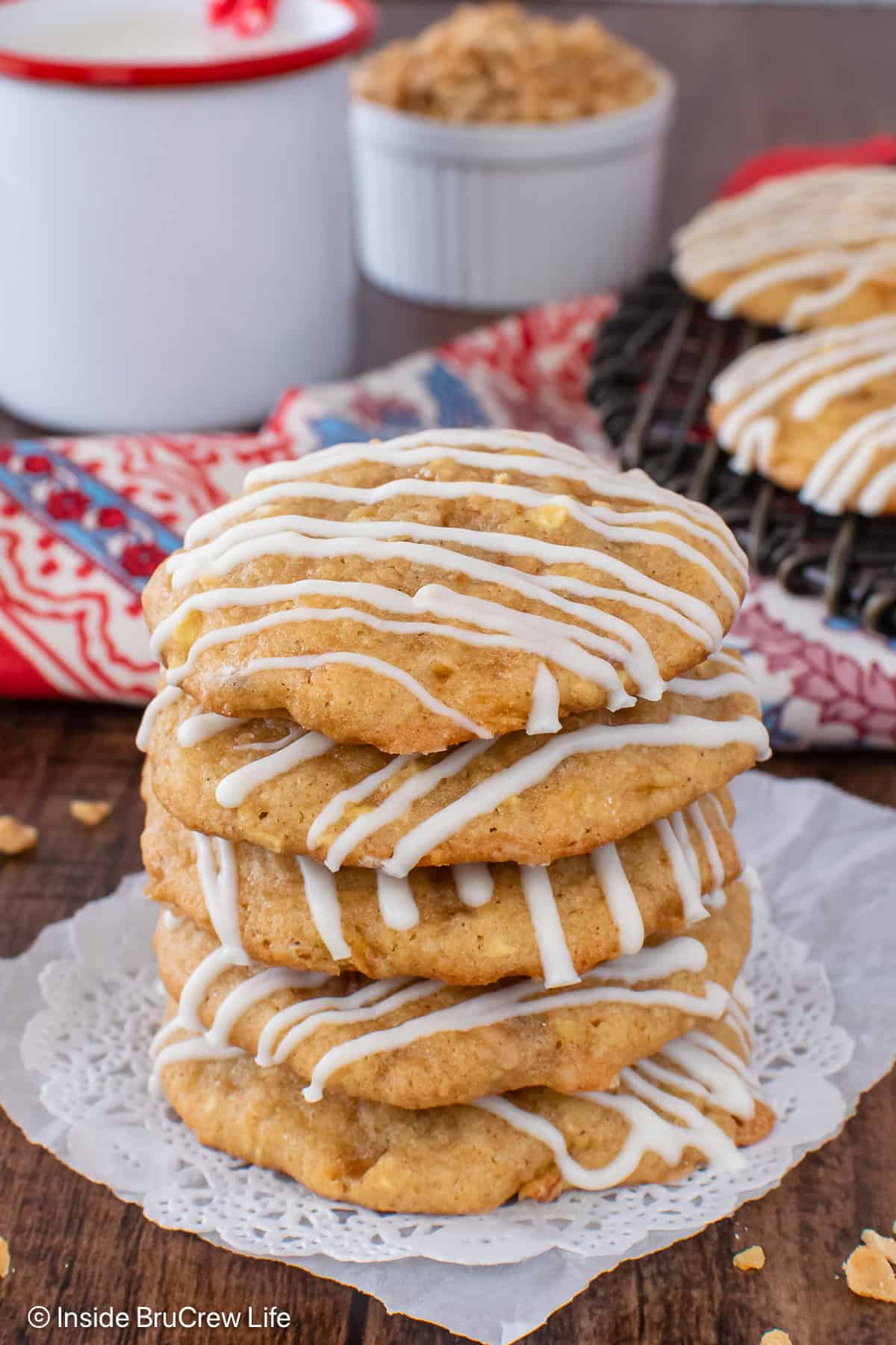 A stack of four toffee apple pie cookies on parchment paper.