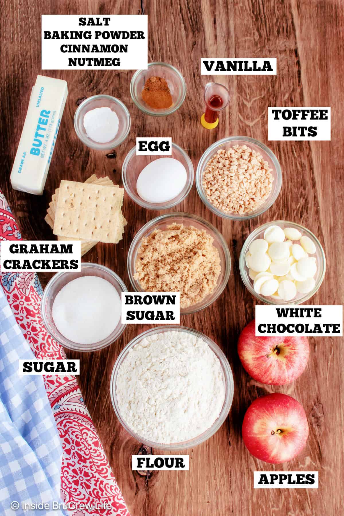 Ingredients for toffee apple cookies on a board with text labels.