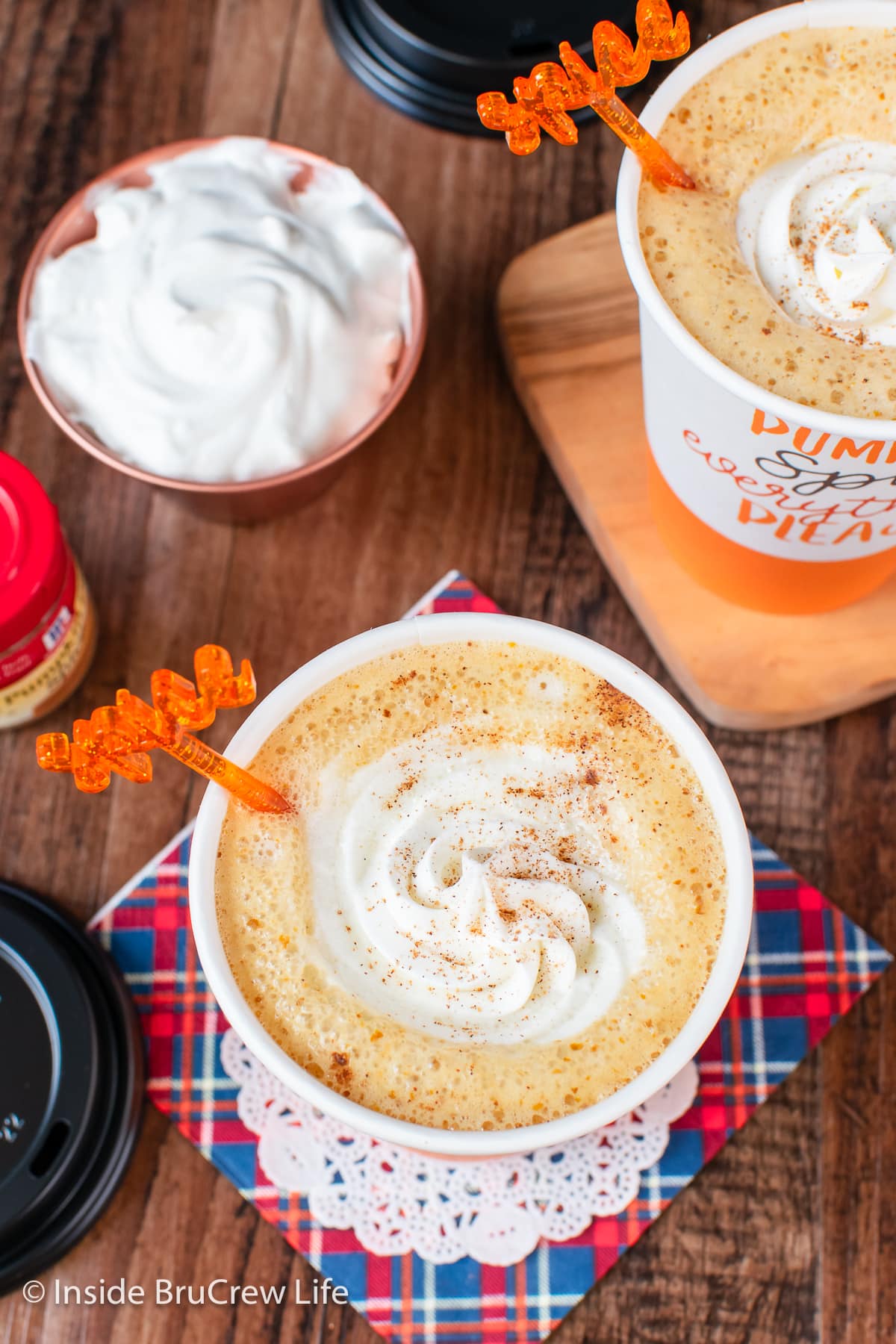 A pumpkin coffee topped with whipped cream.