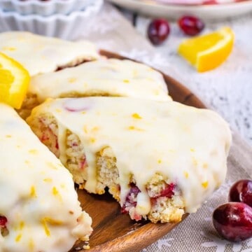 Cranberry Orange scones on a wooden plate.