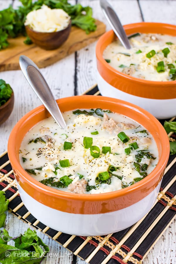 Low Carb Sausage Kale Soup - kale, Italian sausage, and cauliflower in a creamy broth makes a delicious and low carb dinner choice. Make this easy recipe for busy cold nights! #lowcarb #healthy #ketofriendly #cauliflower #sausage #soup #ad #recipe