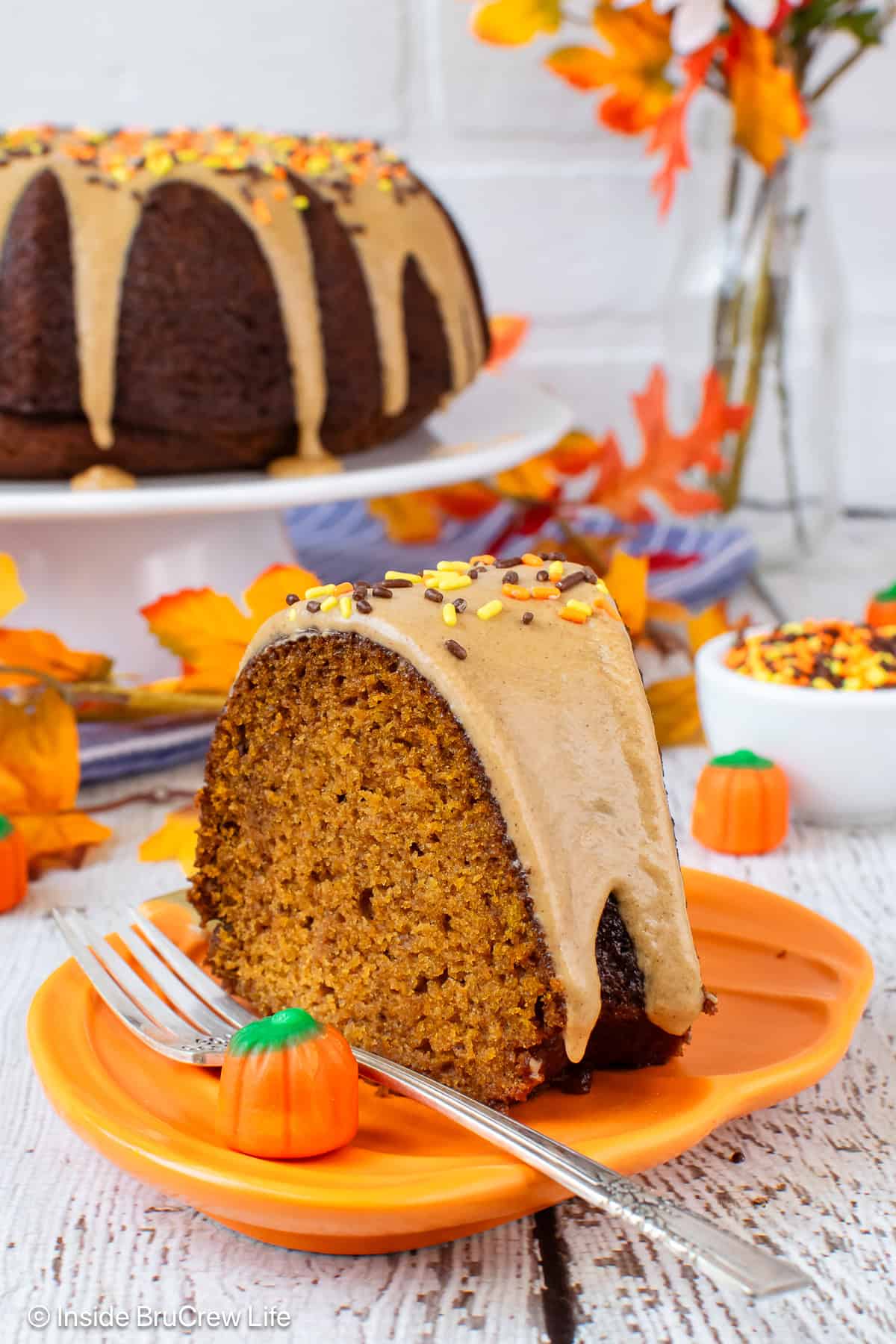 A slice of pumpkin bundt cake on a plate.