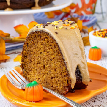 An orange plate with a slice of pumpkin bundt cake topped with maple glaze.