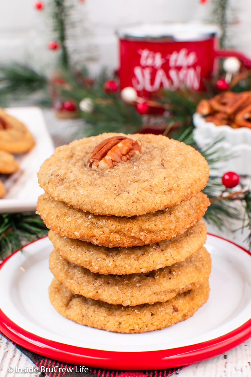 A stack of thin chewy cookies on a plate.