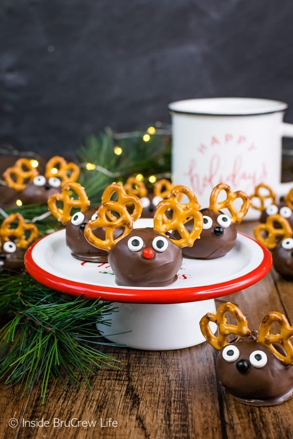 Multiple peanut butter balls decorated to be Peanut Butter Reindeer.