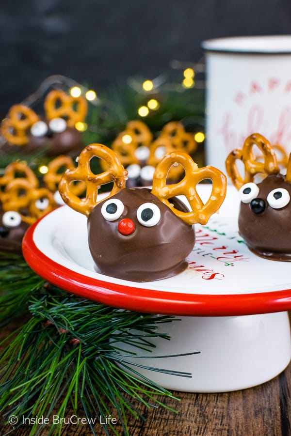 A white cake plate with a red rim and Peanut Butter Reindeer on it.