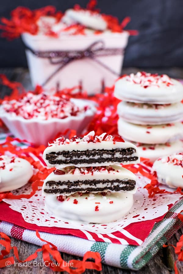 A Christmas napkin with stacks of peppermint Oreos on it.