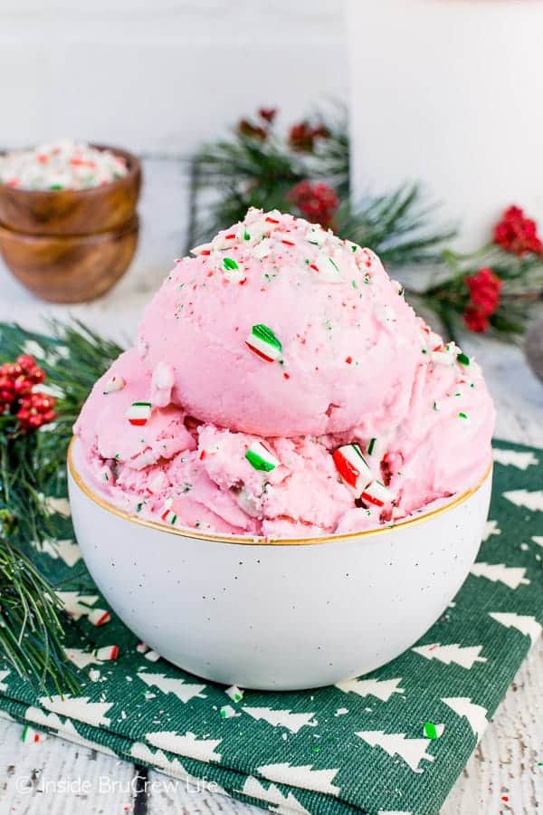 A bowl of pink Peppermint Stick Ice Cream in a white bowl.