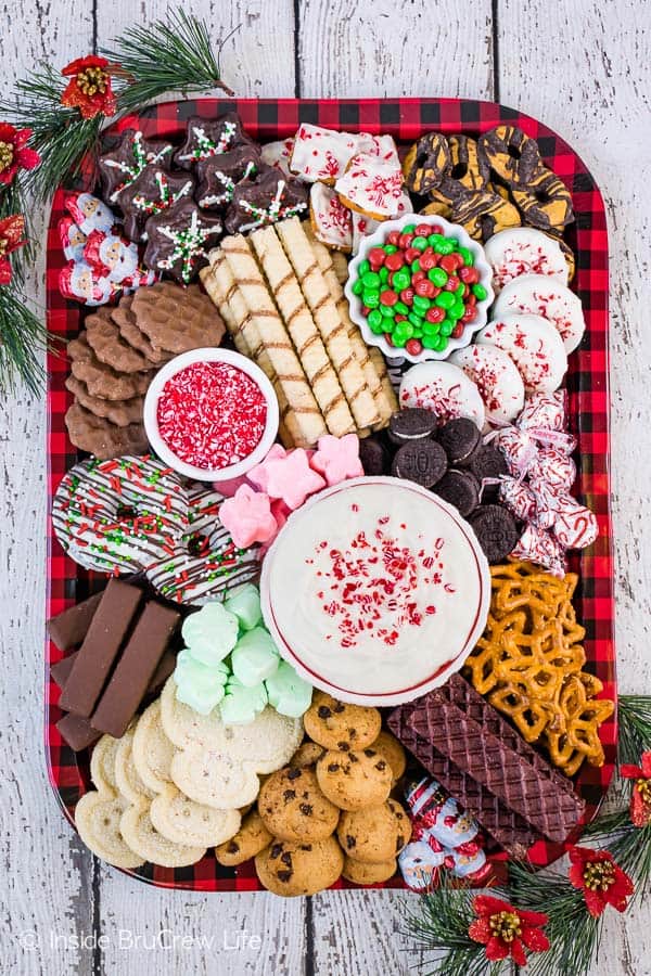 A tray full of cookies with White Chocolate Peppermint Cheesecake Dip.