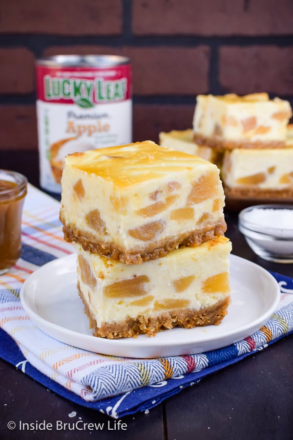 Apple Cheesecake Bars - these creamy cheesecake bars are loaded with apple pie filling. Add a drizzle of salted caramel for a fun flavor combo! #apple #cheesecake #cheesecakebars #piefilling #dessert #easyrecipe