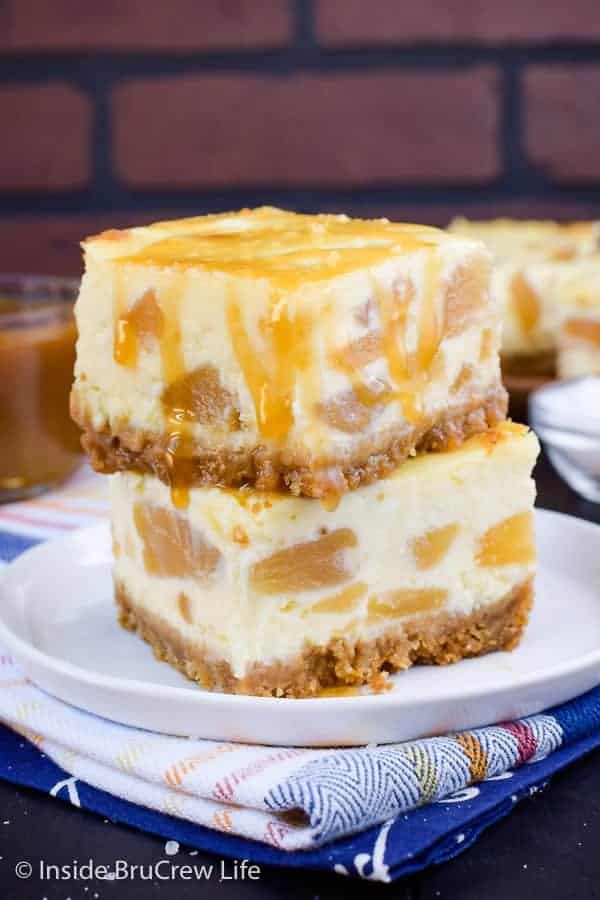 Apple Cheesecake Bars - these creamy cheesecake bars have a graham cracker crust and salted caramel drizzle that makes them taste amazing! Try this easy recipe when you need a dessert to share! #apple #cheesecake #cheesecakebars #piefilling #dessert #easyrecipe