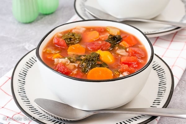 A white bowl filled with a healthy low carb veggie soup.